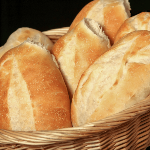 Qual é a origem do apelido “média” dado pelos santistas para o pão francês?
